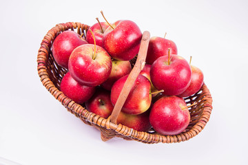 Basket full of apples on a white background