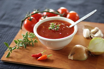 Homemade chilli sauce (dressing) with tomatoes, garlic, herbs and onion