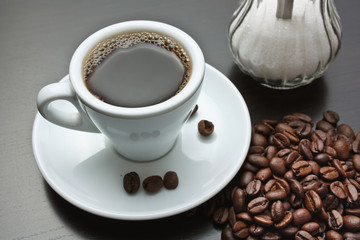 pile of coffee beans and a cup