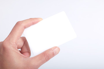 Obraz premium Blank VIP white card hold by hand