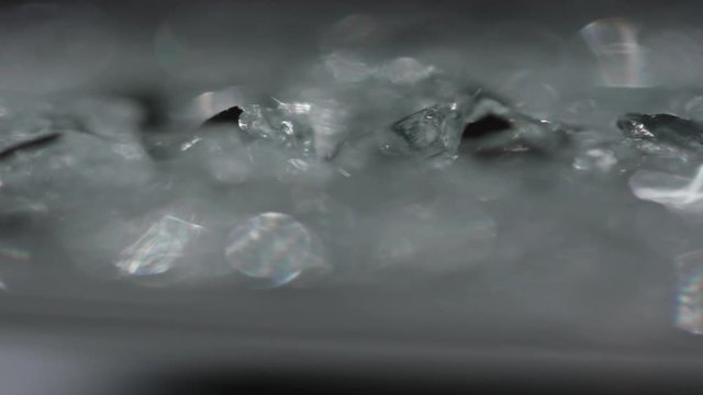 The Anamorph Bokeh stock video features a circle rotation in a clockwise direction of grey blurred lights. You can use it as an overlay for creative video effects, artistic videos, and as a texture by