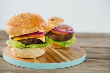 Burgers on cutting board