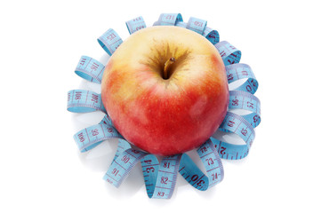 blue measure tape and red apple  isolated