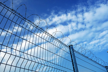 Fototapeta na wymiar Fence and barbed wire