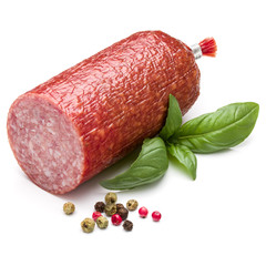 Salami smoked sausage, basil leaves and peppercorns isolated on white background cutout
