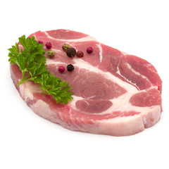 Raw pork neck chop meat with parsley herb leaves and peppercorn spices garnish isolated on white background cutout