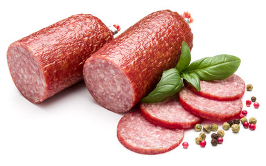 Salami smoked sausage, basil leaves and peppercorns isolated on white background cutout