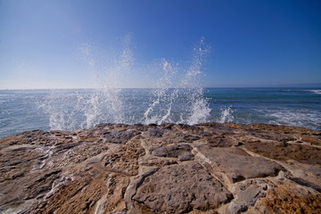 Wave of blue ocean on sandy beach. Background.