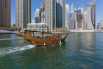 Fototapeta na wymiar Wooden ship for tourists in Dubai Marina
