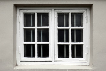 Fototapeta na wymiar Window on a wooden white house