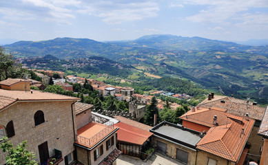 Fototapeta na wymiar Landscape with roofs of houses in small tuscan town in province