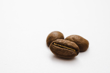Coffee beans on white background. Macro.