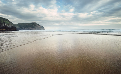 Ocean waves on the sand beach, Northern Spain
