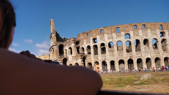 Tourist taking a picture at the colloseum