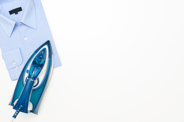 Blue iron and shirt on ironing board