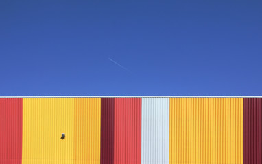 Sunny Sky at an Industrial Estate with colourful corrugated iron warehouses