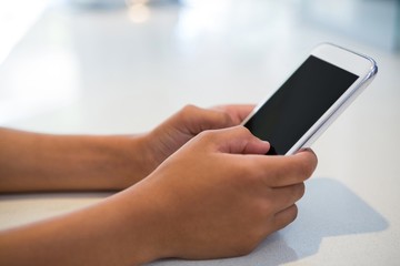 Close-up of girl using mobile phone