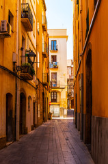 Fototapeta na wymiar charming narrow street, street with colorful facades of buildings, vintage style