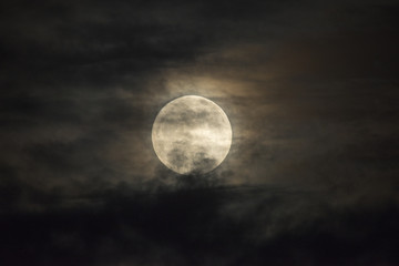 Full moon and clouds at night