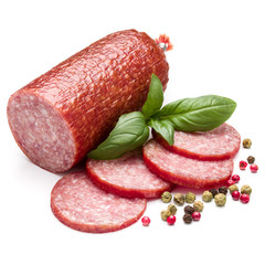 Salami smoked sausage, basil leaves and peppercorns isolated on white background cutout
