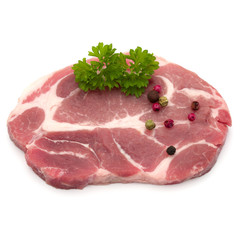 Raw pork neck chop meat with parsley herb leaves and peppercorn spices garnish isolated on white background cutout
