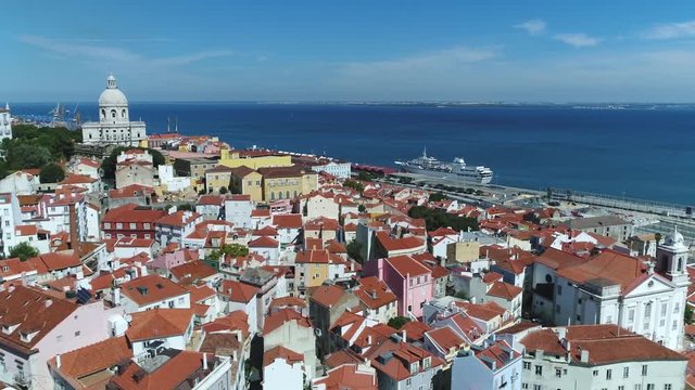 Aerial view Portugal Lisbon the Alfama is oldest district of Lisbon spreading on slope between Sao Jorge Castle and Tejo river its name comes from the Arabic Al-hamma meaning hot fountains or bath