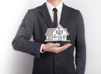 Young man giving empty hand on black background.Hands open businessman.