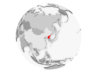 North Korea on grey globe isolated