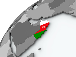 Flag of Oman on grey globe