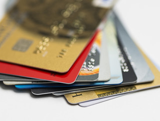 Stack of multicolored credit cards close-up	
