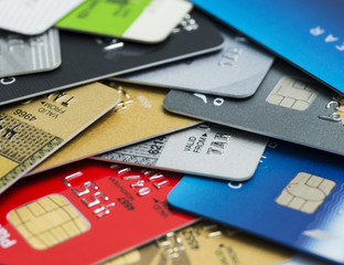 Stack of multicolored credit cards close-up	
