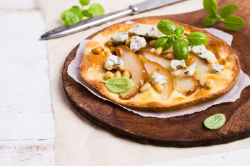 Traditional pizza with pear