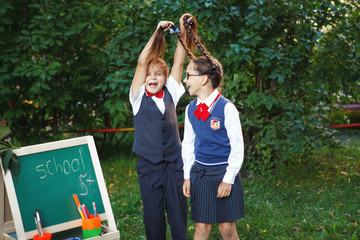 boy pulling girl's hair, flirting
