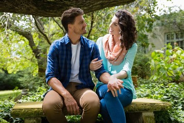 Romantic couple interacting with each other in garden