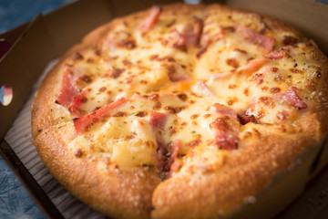 Hawaiian Pizza with bacon sweet pineapple and cheese.