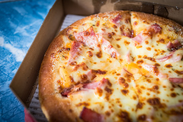 Hawaiian Pizza with bacon sweet pineapple and cheese.