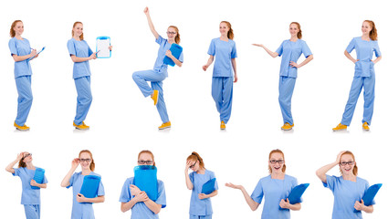 Obraz premium Pretty dancing doctor in blue uniform with documents isolated