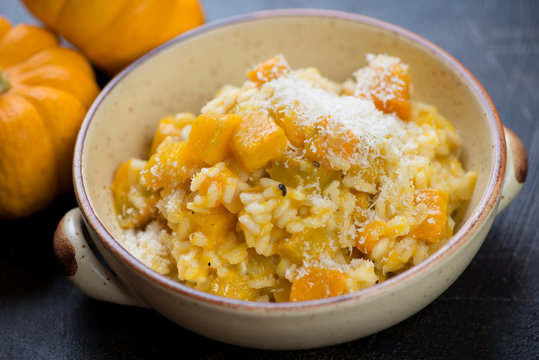 Close-up of a bowl with pumpkin risotto, selective focus, studio shot
