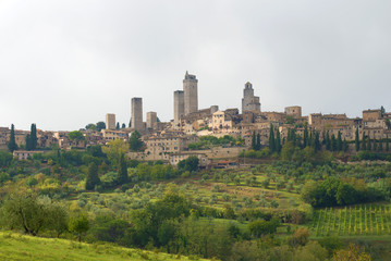 Fototapeta na wymiar A view of the city of San Gimignano on a cloudy September day. Italy