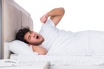 Man in bed suffering from insomnia
