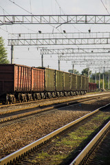 Obraz premium View on the railroad track and cargo train
