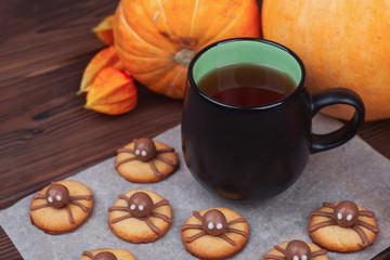 composition of homemade halloween cookies with cup of coffee