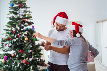 Young family expecting child baby celebrating christmas