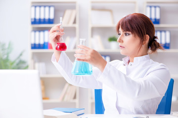 Female scientist researcher conducting an experiment in a labora