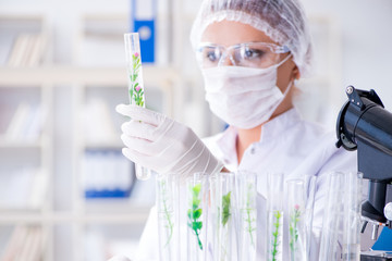 Female scientist researcher conducting an experiment in a labora