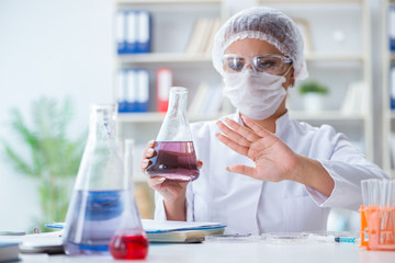 Female scientist researcher conducting an experiment in a labora
