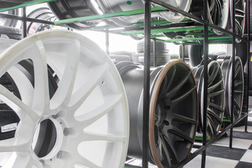 Shop shelves with automobile car alloy wheels.