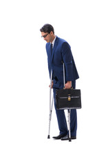 Businessman walking with crutches isolated on white background