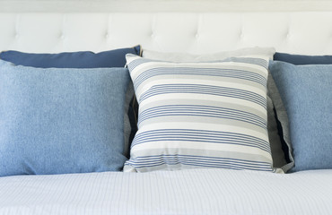 blue pillow on bed