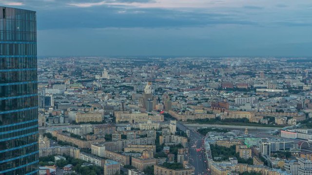 Aerial top view of Moscow city day to night timelapse after sunset. Form from the observation platform of the business center of Moscow City.